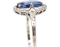 Art Deco Platinum Ring set with an Oval Sapphire & Small Diamonds