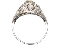 Art Deco Platinum Pierced Bombè Cluster Ring set with a Pale Yellow Diamond & Rose Diamonds