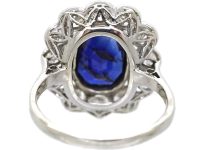 Early 20th Century Platinum, Large Sapphire & Diamond Oval Cluster Ring