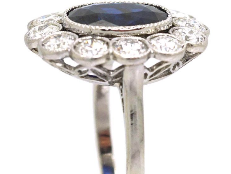 Early 20th Century Platinum, Large Sapphire & Diamond Oval Cluster Ring