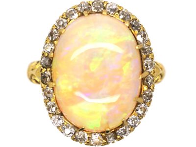 Edwardian 18ct Gold Ring set with a Large Cabochon Opal surrounded by Diamonds