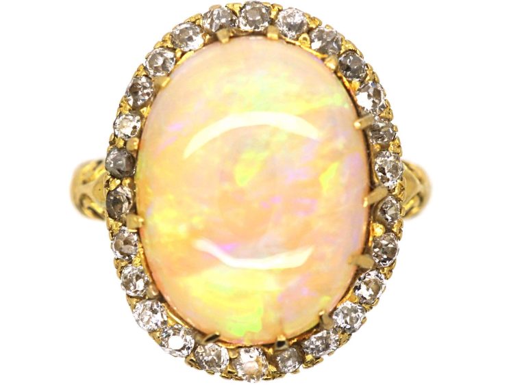 Edwardian 18ct Gold Ring set with a Large Cabochon Opal surrounded by Diamonds