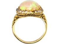 Edwardian 18ct Gold Ring set with a Large Cabochon Opal surrounded by Diamonds