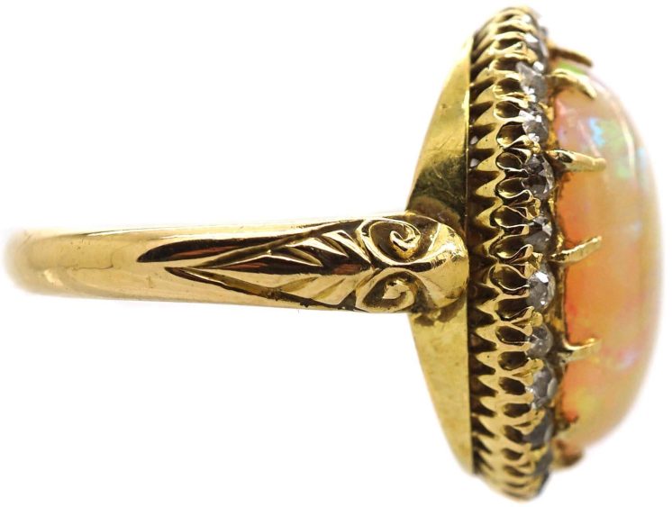 Edwardian 18ct Gold Ring set with a Large Cabochon Opal surrounded by Diamonds