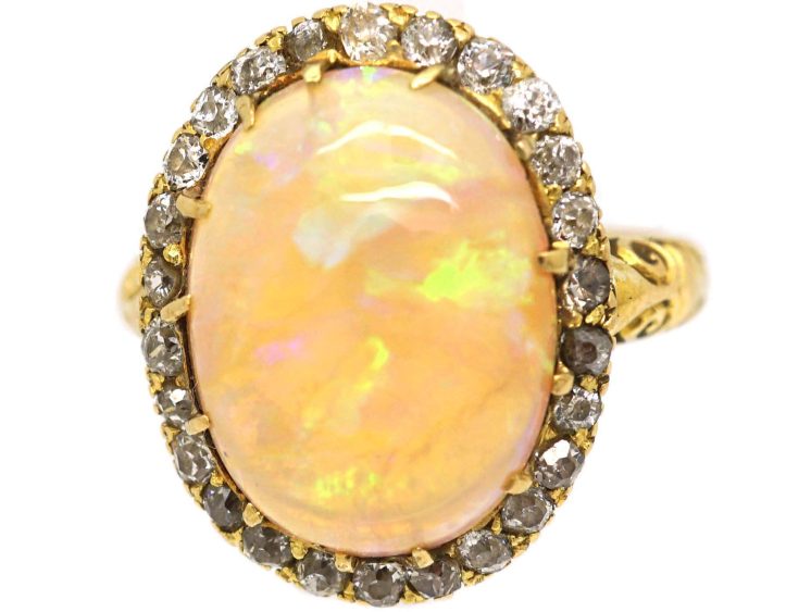 Edwardian 18ct Gold Ring set with a Large Cabochon Opal surrounded by Diamonds