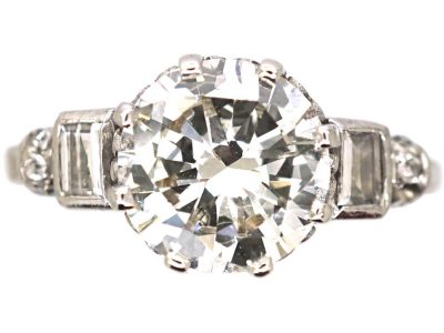 Art Deco Platinum Diamond Solitaire Ring with Baguette Cut Diamond Step Cut Shoulders
