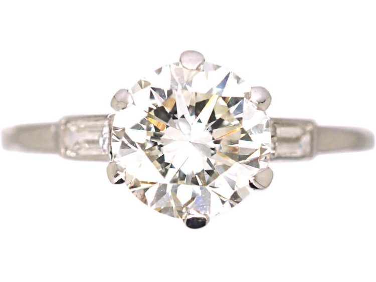 Platinum Solitaire Diamond Ring with Baguette Diamond Shoulders