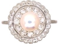 Early 20th Century Platinum Cluster Ring set with a Bouton Pearl & Diamonds