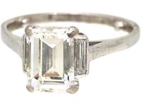 Art Deco 18ct White Gold Ring set with a Rectangular Cut Diamond with Baguette Cut Diamond Shoulders
