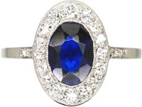 Early 20th Century Platinum Ring set with an Oval Cut Sapphire & Diamonds