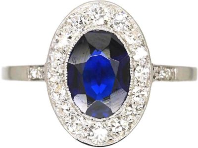 Early 20th Century Platinum Ring set with an Oval Cut Sapphire & Diamonds