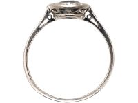 Early 20th Century Platinum Ring set with an Oval Cut Sapphire & Diamonds
