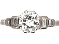 Art Deco Platinum Solitaire Diamond Ring with Step Cut Shoulders set with Baguette Diamonds