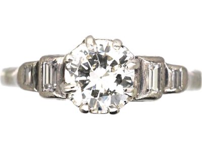 Art Deco Platinum Solitaire Diamond Ring with Step Cut Shoulders set with Baguette Diamonds