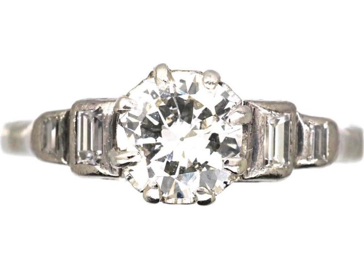 Art Deco Platinum Solitaire Diamond Ring with Step Cut Shoulders set with Baguette Diamonds