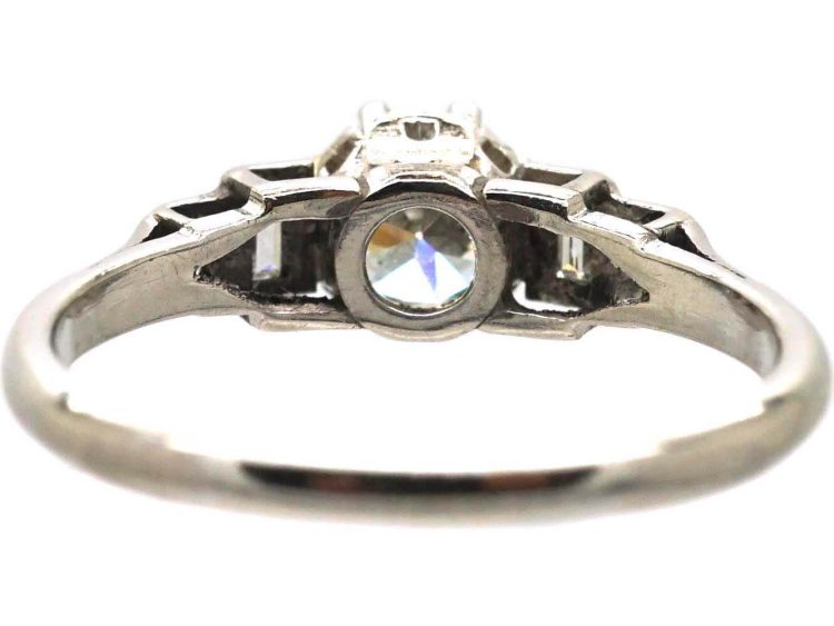 Art Deco Platinum Solitaire Diamond Ring with Step Cut Shoulders set with Baguette Diamonds