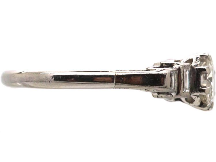 Art Deco Platinum Solitaire Diamond Ring with Step Cut Shoulders set with Baguette Diamonds