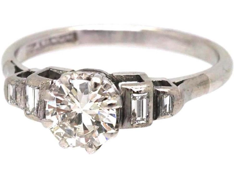 Art Deco Platinum Solitaire Diamond Ring with Step Cut Shoulders set with Baguette Diamonds