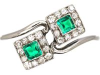 Art Deco Platinum Crossover Ring set with Two Emeralds & Diamonds