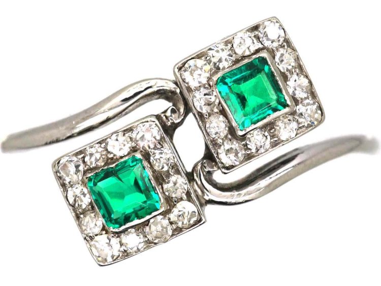 Art Deco Platinum Crossover Ring set with Two Emeralds & Diamonds