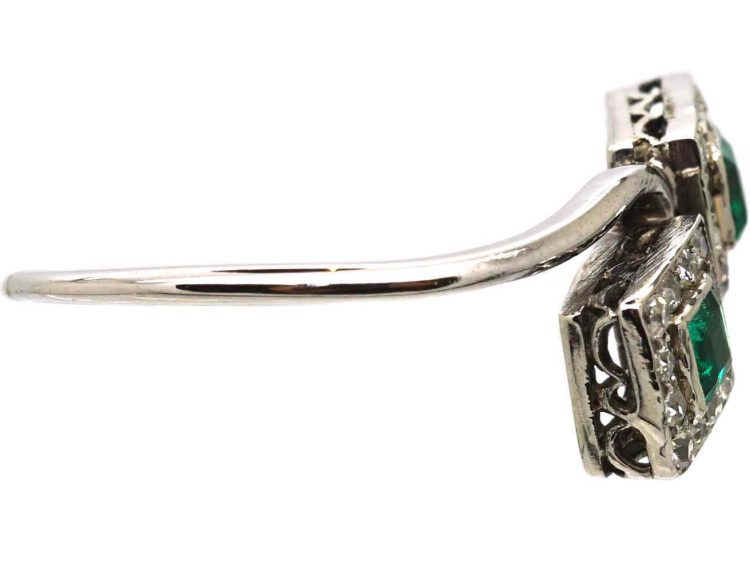 Art Deco Platinum Crossover Ring set with Two Emeralds & Diamonds