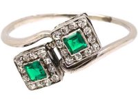 Art Deco Platinum Crossover Ring set with Two Emeralds & Diamonds