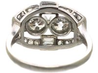 Art Deco Platinum Two Stone Diamond Ring with an Oval Surround of Baguette & Round Diamonds
