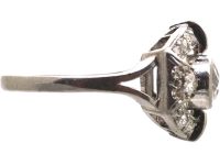 Art Deco Platinum Two Stone Diamond Ring with an Oval Surround of Baguette & Round Diamonds