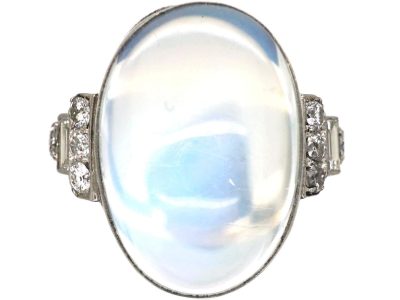 Art Deco Platinum Ring set with a Large Moonstone with Step Cut Shoulders set with Diamonds
