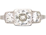 Art Deco Platinum Three Stone Diamond Ring with Step Cut Detail