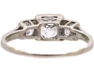 Art Deco Platinum Three Stone Diamond Ring with Step Cut Detail