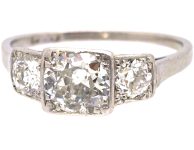 Art Deco Platinum Three Stone Diamond Ring with Step Cut Detail