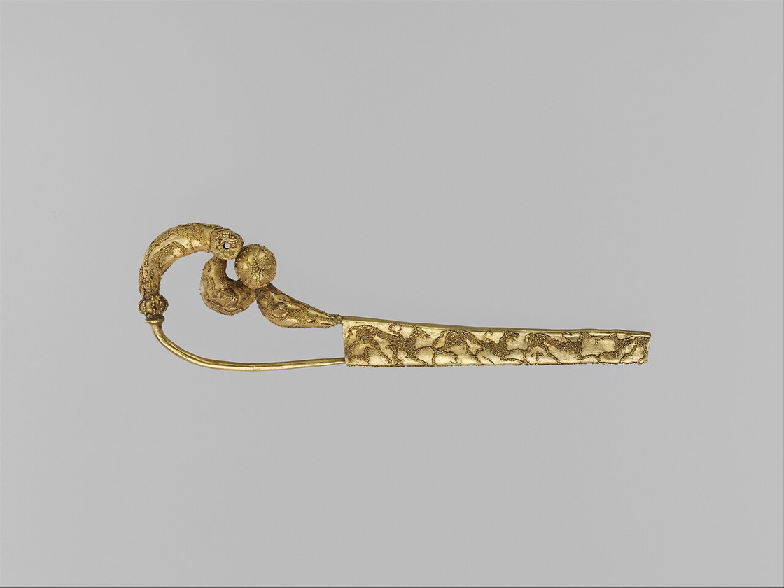 Etruscan gold fibula decorated with granulation