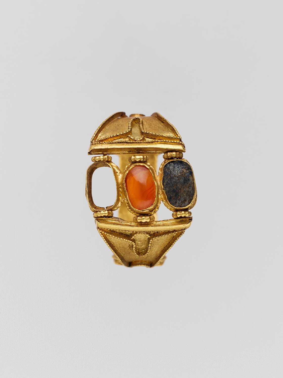 Ancient gold ring with stones in box settings