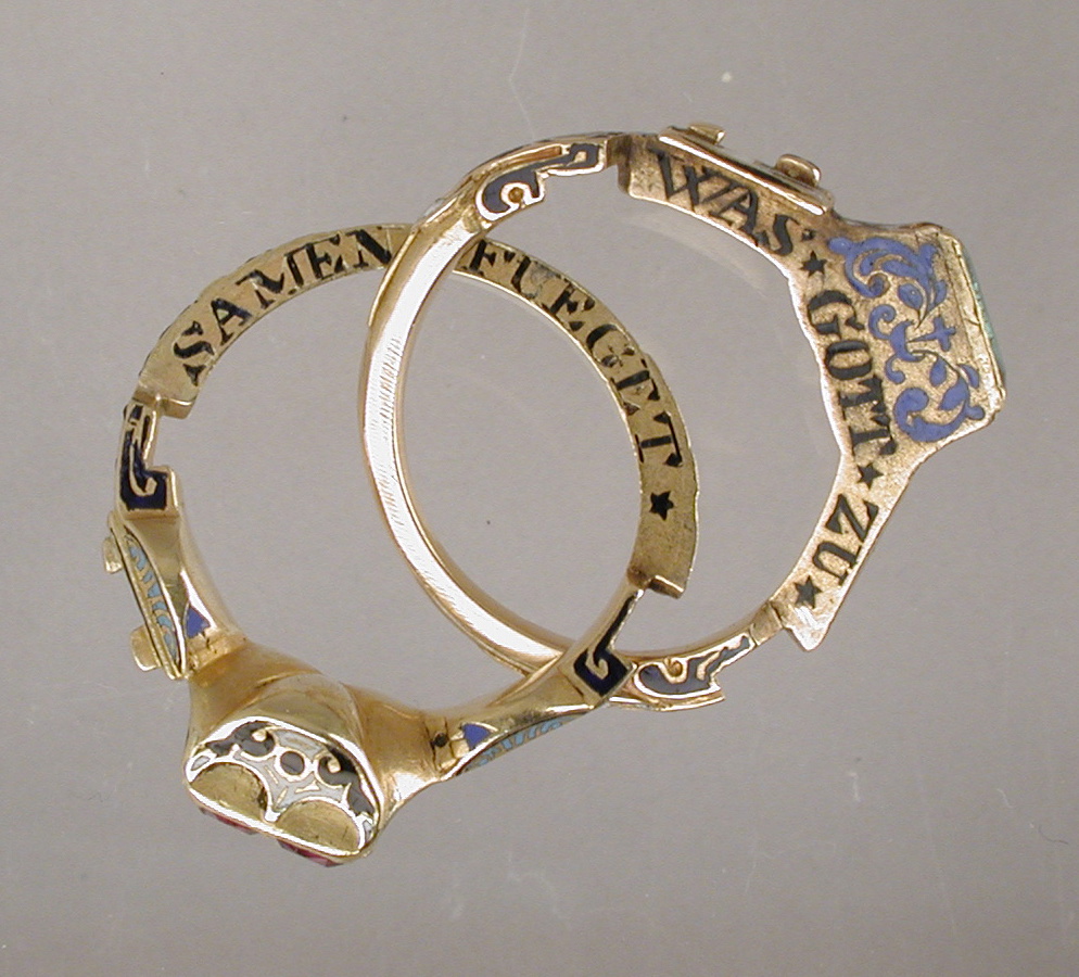 Sixteenth-century gimmel ring opened to show its two inscribed hoops